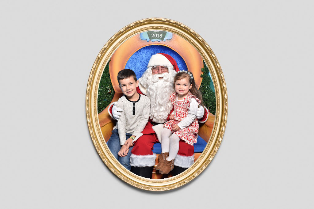 Oval Gold frame around a photo of Santa and Kiddies