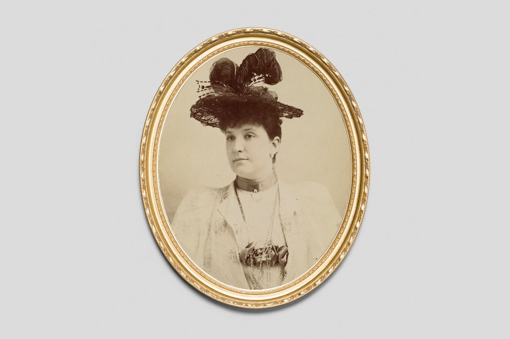 Oval Gold frame around a photo of Dame Nellie Melba