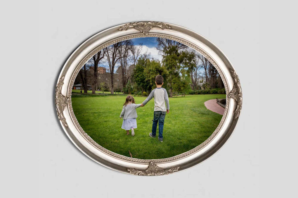 Oval Silver frame around a photo of Brother and Sister