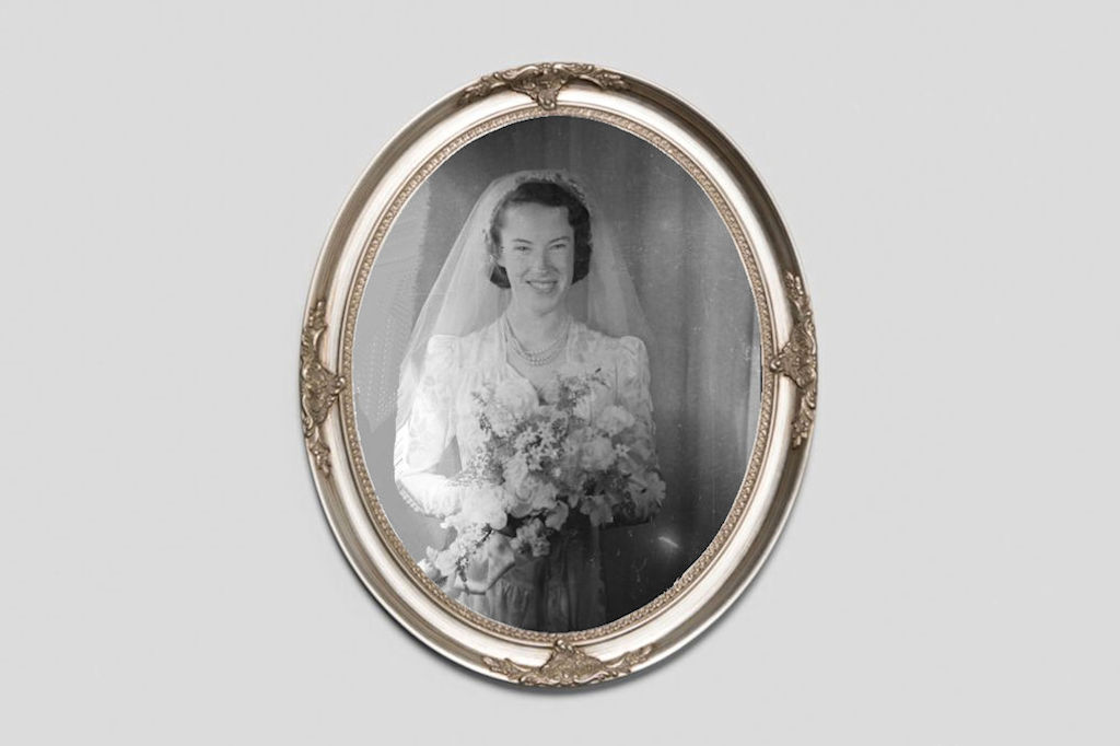 Oval Silver frame around an old black and white photo of a Happy Bride